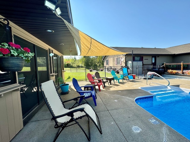 view of swimming pool featuring a patio