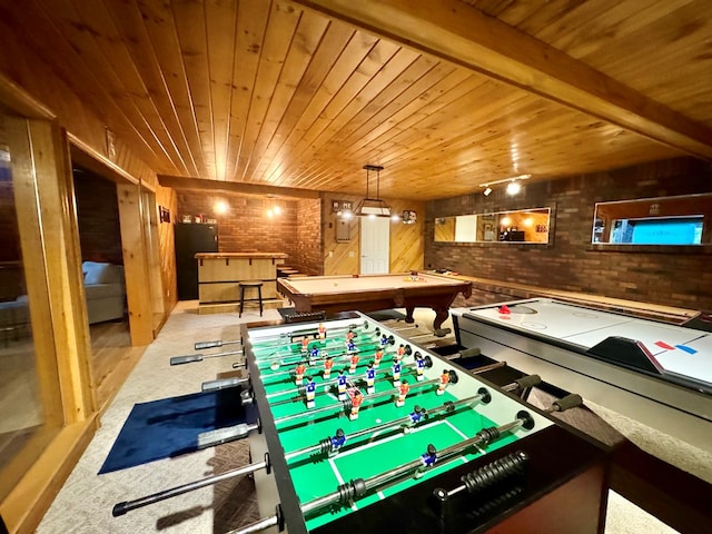 recreation room with brick wall, light carpet, wooden ceiling, beamed ceiling, and wood walls