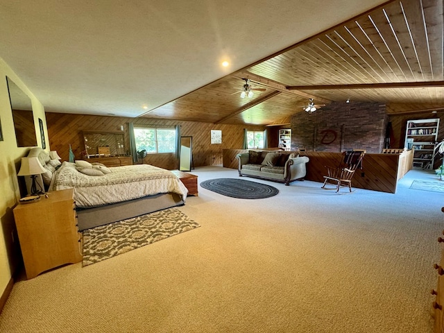 carpeted bedroom with multiple windows, vaulted ceiling with beams, wood ceiling, and wood walls