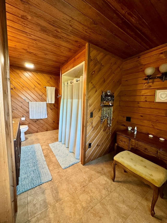 bathroom featuring wooden walls, wooden ceiling, and toilet