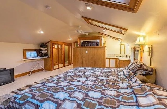 bedroom with vaulted ceiling and light carpet