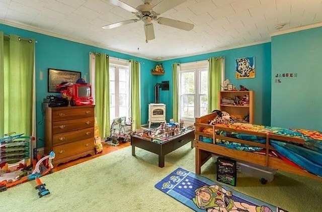 recreation room with crown molding and ceiling fan