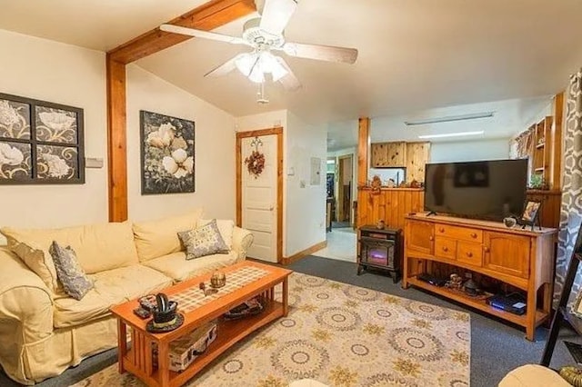 carpeted living room featuring lofted ceiling with beams and ceiling fan