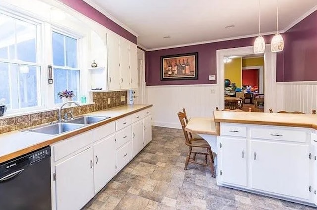 kitchen with pendant lighting, dishwasher, and white cabinets