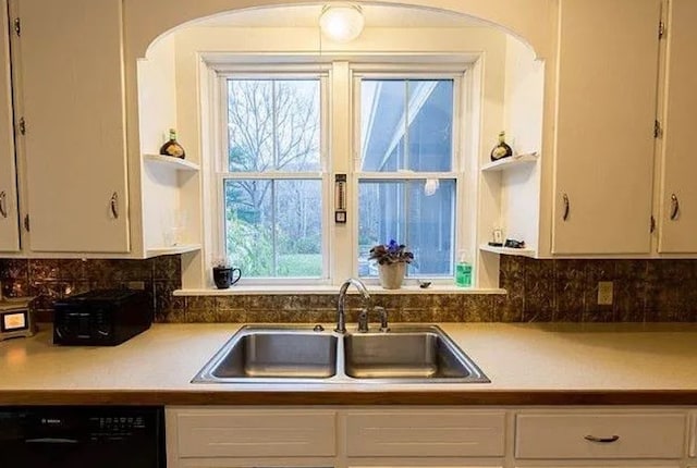 kitchen with white cabinetry, sink, tasteful backsplash, and dishwasher