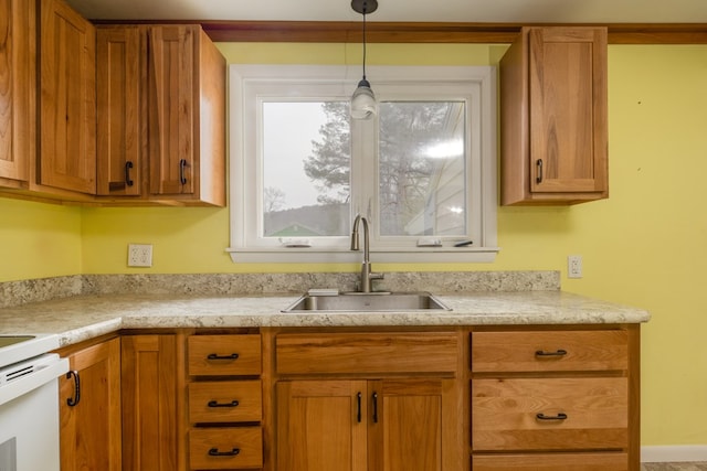 kitchen featuring sink and decorative light fixtures