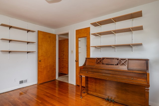 miscellaneous room featuring hardwood / wood-style flooring