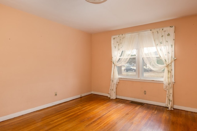 empty room featuring hardwood / wood-style floors