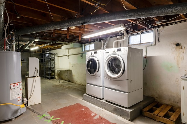 basement with washer and dryer and water heater