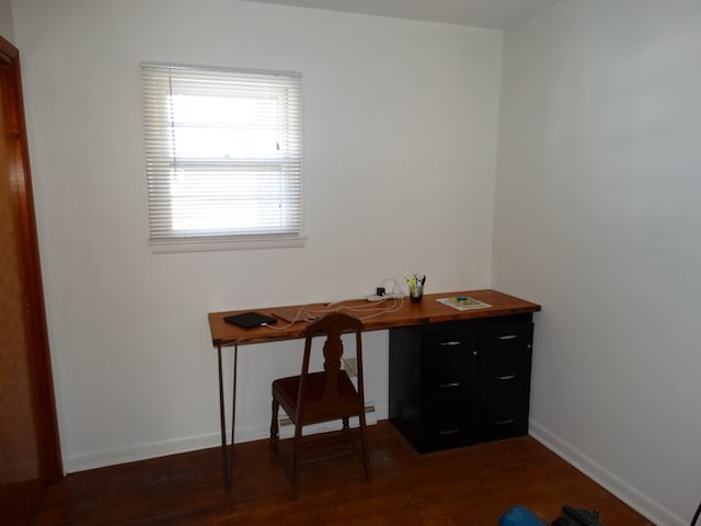 office space with dark wood-type flooring