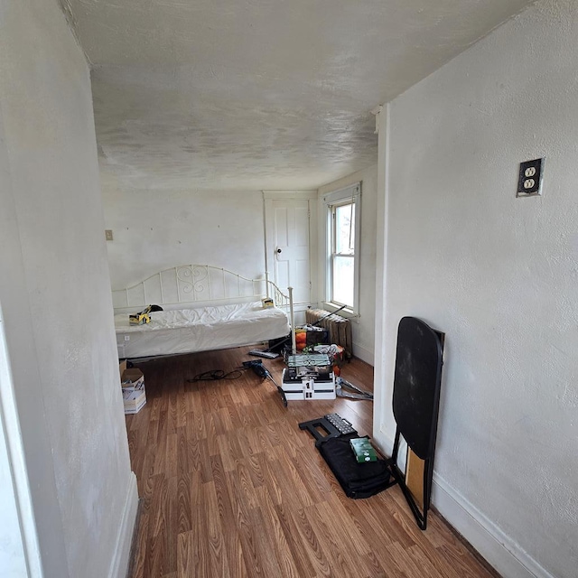 bedroom featuring wood-type flooring