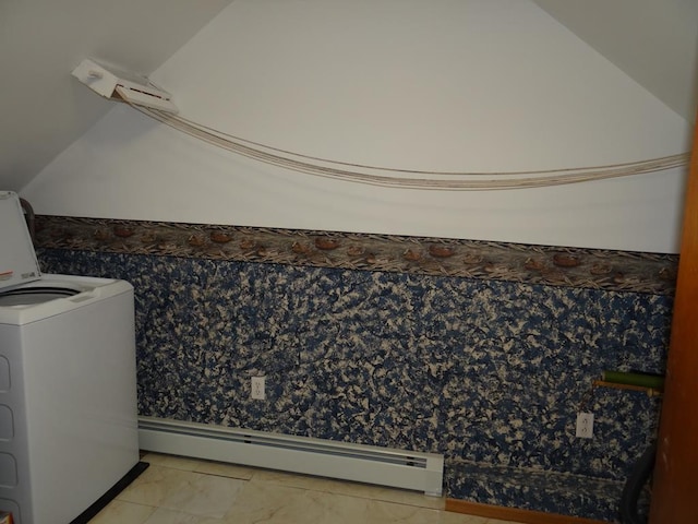 bathroom with a baseboard radiator, washer / dryer, and vaulted ceiling