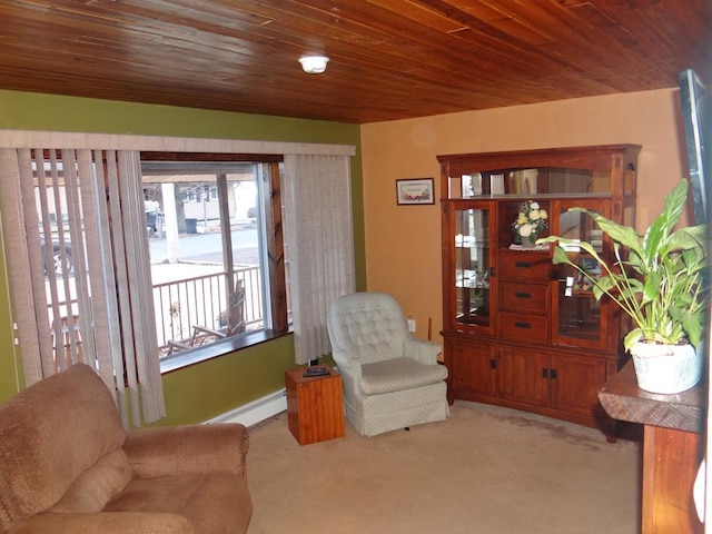 living area featuring a baseboard radiator, light carpet, and wooden ceiling