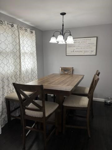 dining space featuring a notable chandelier