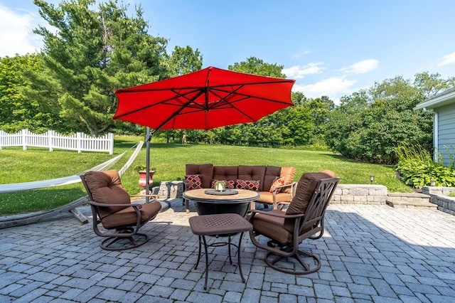 view of patio / terrace featuring an outdoor living space with a fire pit