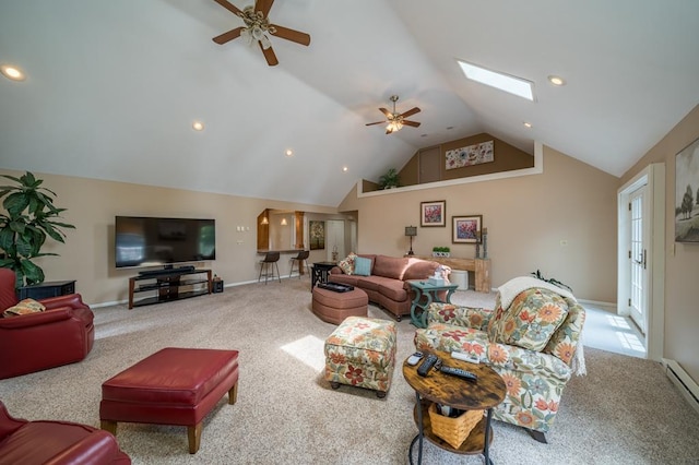 carpeted living room featuring a skylight, high vaulted ceiling, ceiling fan, and baseboard heating