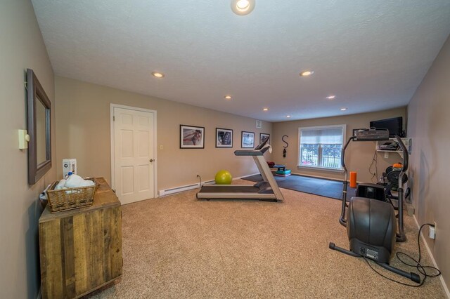 workout room featuring a baseboard radiator and carpet flooring