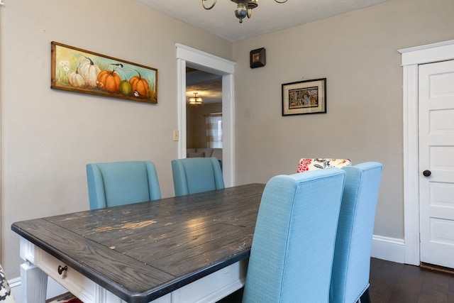 dining space with dark wood-type flooring