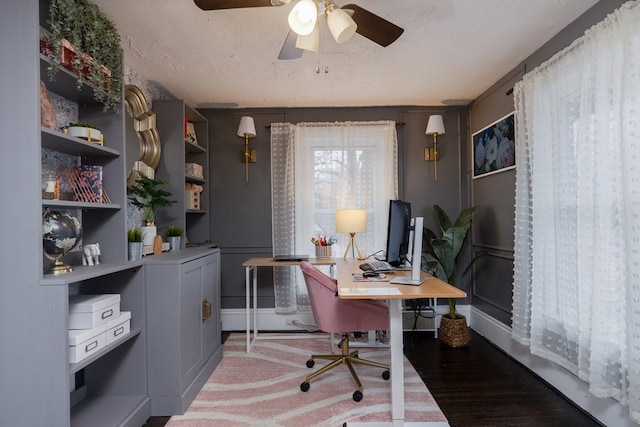 office space with ceiling fan, a textured ceiling, and light hardwood / wood-style flooring