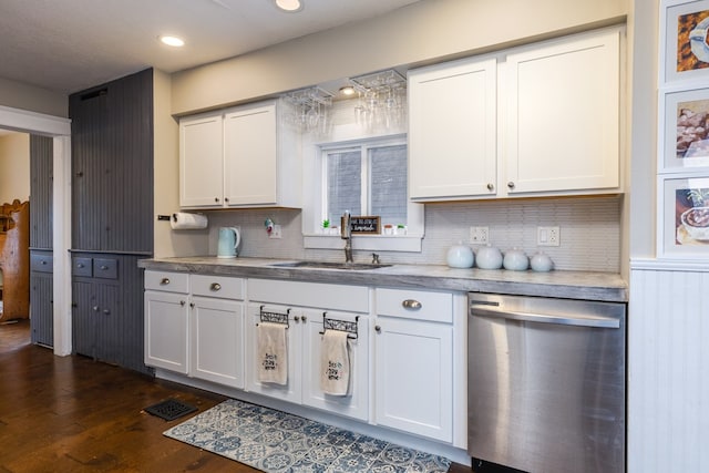 kitchen with white cabinetry, sink, backsplash, and stainless steel dishwasher