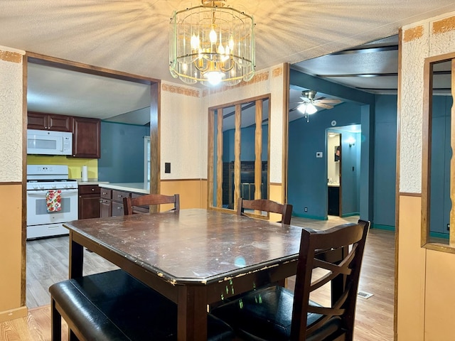 dining space featuring ceiling fan and light hardwood / wood-style flooring