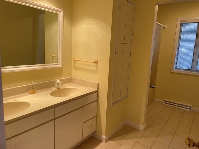 bathroom with vanity and tile patterned floors