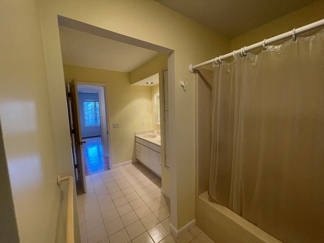 bathroom featuring tile patterned flooring, vanity, and shower / tub combo