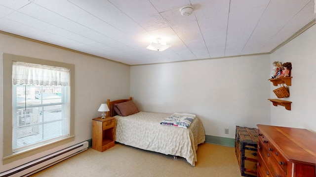 bedroom featuring carpet floors, crown molding, and a baseboard radiator