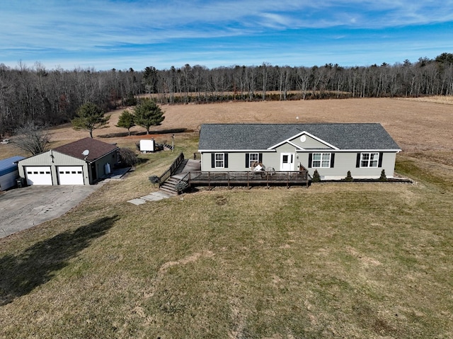 view of front of property featuring a deck and a front lawn