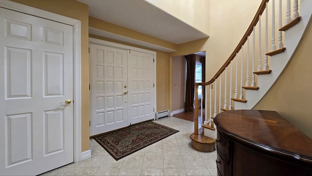 entrance foyer with light tile patterned flooring and baseboard heating