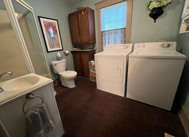 laundry area with sink and washing machine and dryer