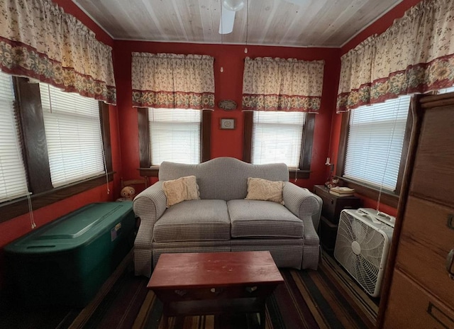 living room featuring a healthy amount of sunlight and wooden ceiling