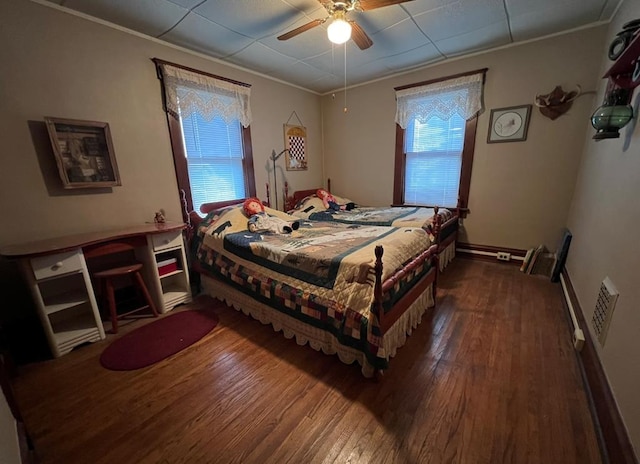 bedroom featuring multiple windows, crown molding, and dark hardwood / wood-style flooring