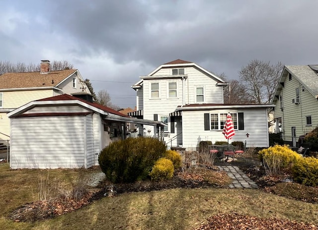 rear view of house with a lawn