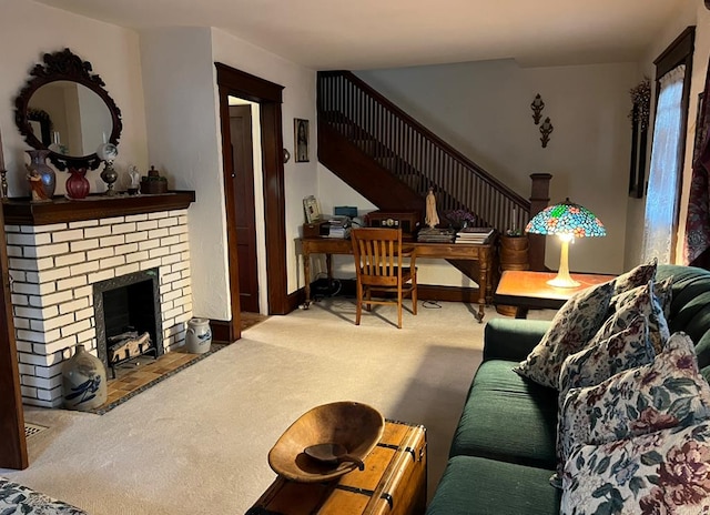 carpeted living room featuring a brick fireplace