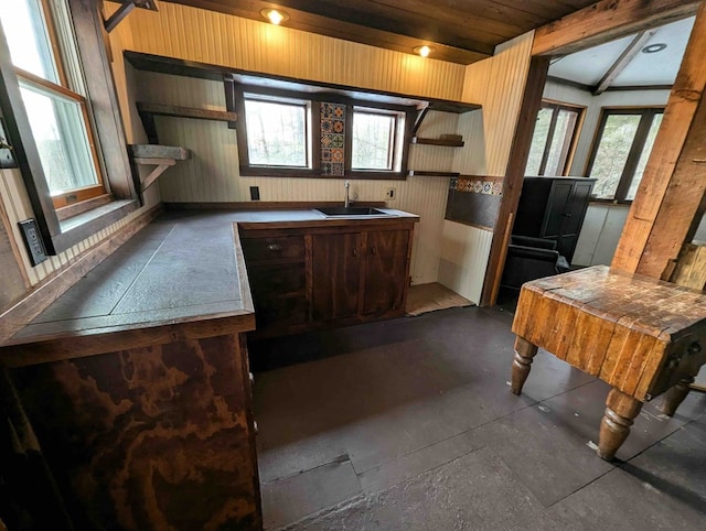 kitchen with sink and beamed ceiling