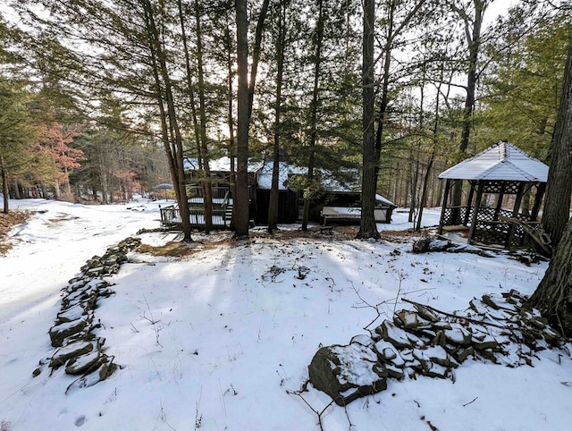 yard layered in snow featuring a gazebo