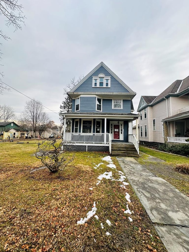 view of front of house featuring a front yard and a porch