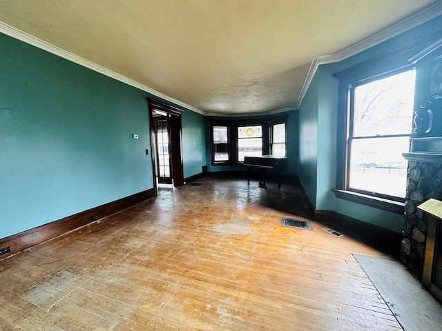 entrance foyer with crown molding and hardwood / wood-style flooring