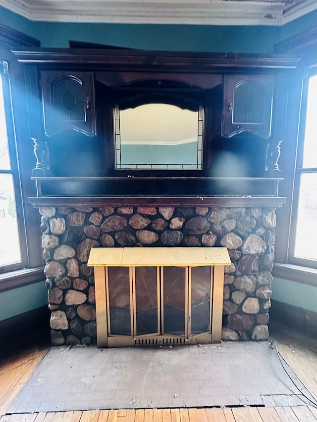 room details with a fireplace and ornamental molding