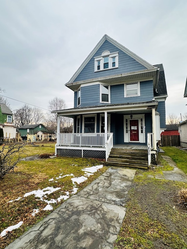 view of front of house featuring a porch and a front lawn