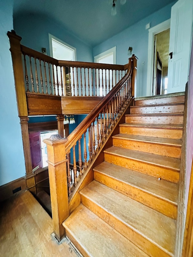 staircase featuring wood-type flooring