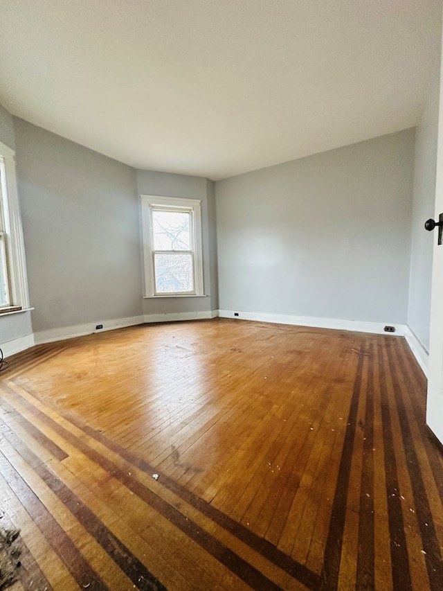 spare room featuring dark wood-type flooring