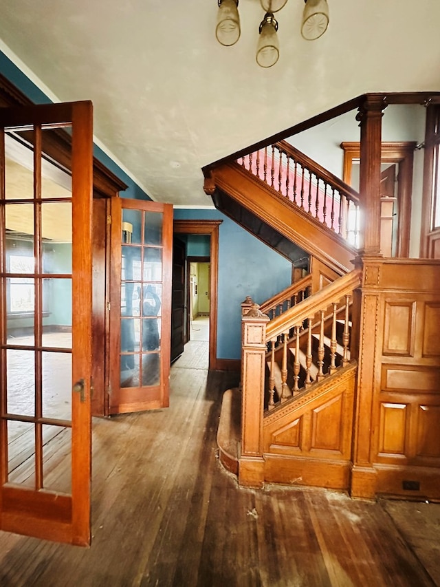 stairway with lofted ceiling and wood-type flooring