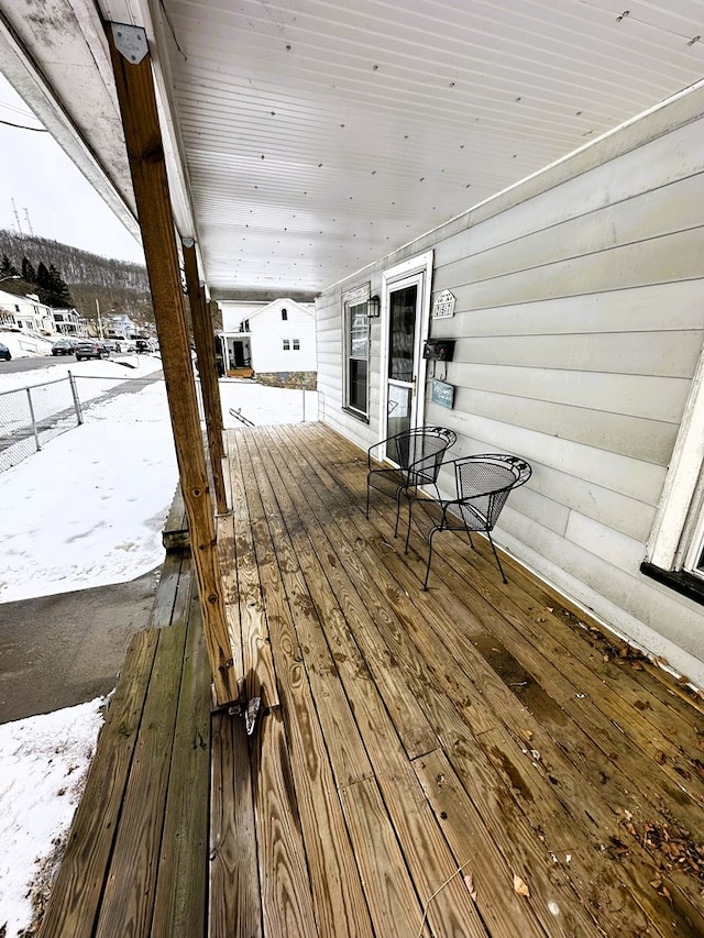 view of snow covered deck