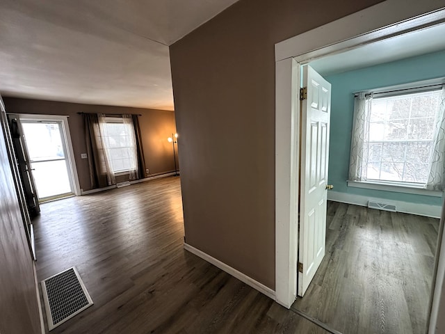 corridor featuring dark hardwood / wood-style floors