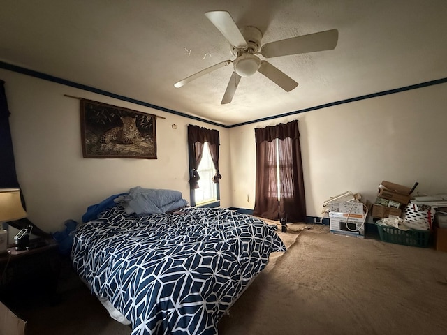 carpeted bedroom featuring ornamental molding and ceiling fan