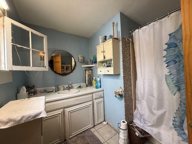 bathroom with vanity and tile patterned flooring