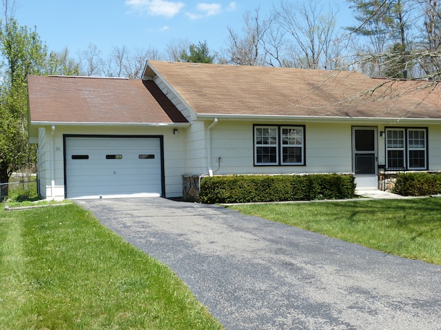 single story home with a front lawn and a garage