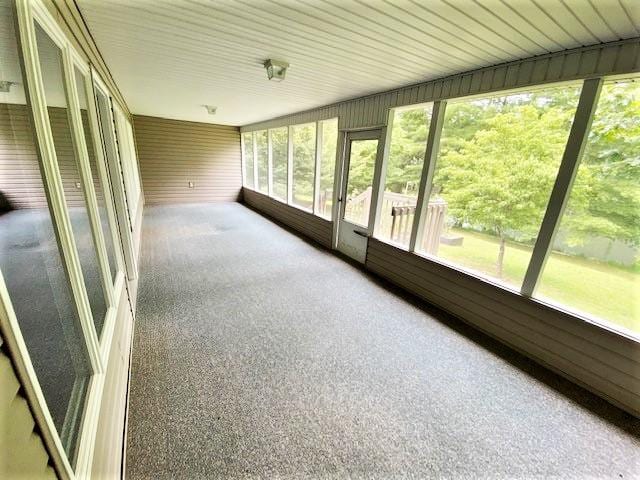 unfurnished sunroom with a wealth of natural light